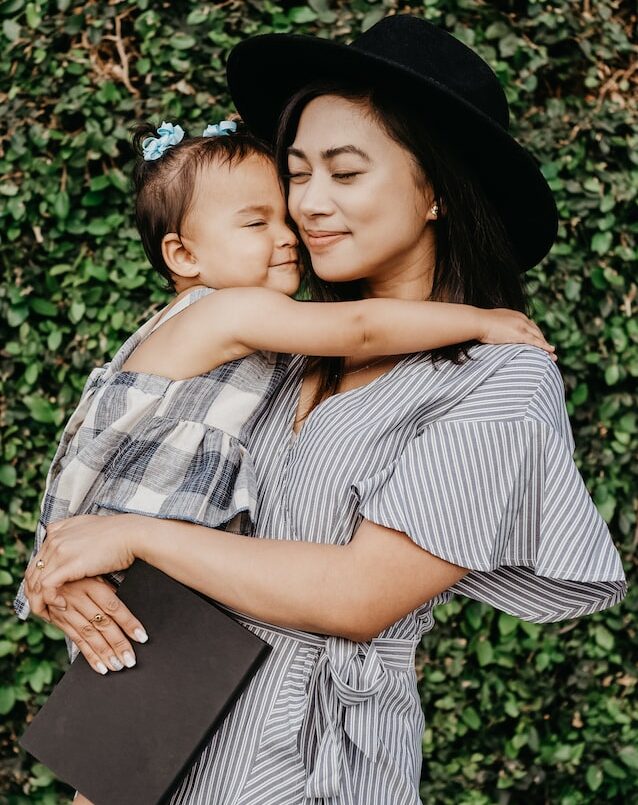 mumechi coaching for mums - mom holding child