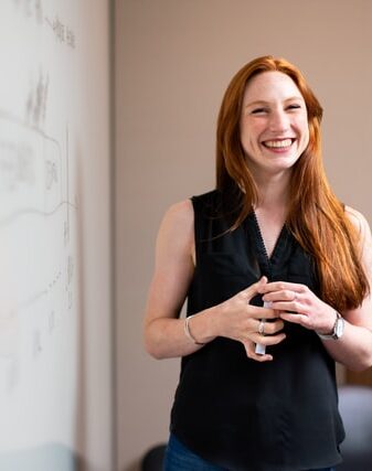 woman teaching a workshop in a school setting spd tuition coaching